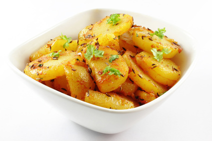 fried potatoes on a white background - Bratkartoffel auf weiem